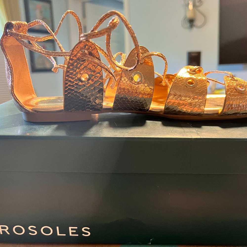 AEROSOL’s never been worn. Rose gold lace up Greek sandals size 8.5